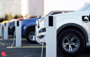 Electric vehicles lined up at charging stations