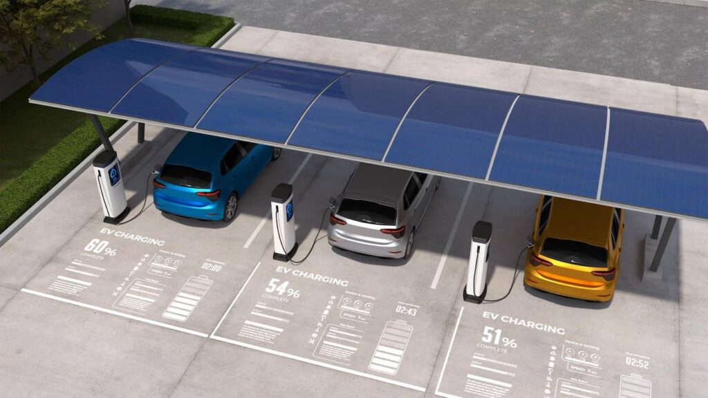 Electric vehicles charging under a solar canopy.