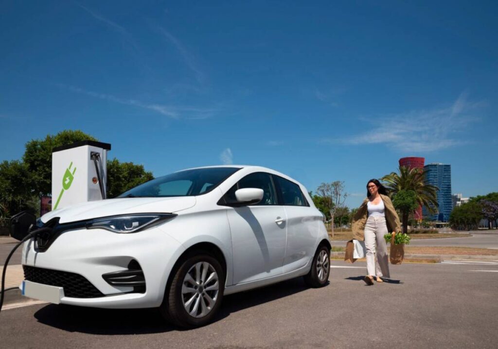 electric car plugged into a charging station, showcasing its eco-friendly design and technology.